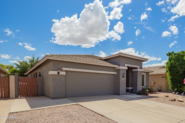 81 E Rock Wren Dr, San Tan Valley, AZ 85143 - view of front of home featuring a garage, stucco siding, a gate, concrete driveway, and a tile roof