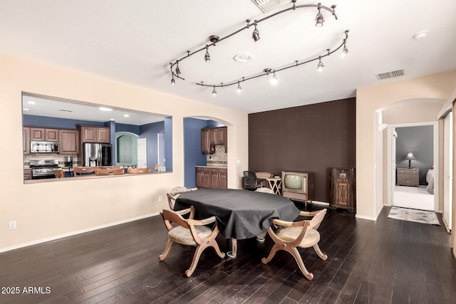 81 E Rock Wren Dr, San Tan Valley, AZ 85143 - dining space featuring arched walkways, hardwood / wood-style floors, baseboards, and pool table