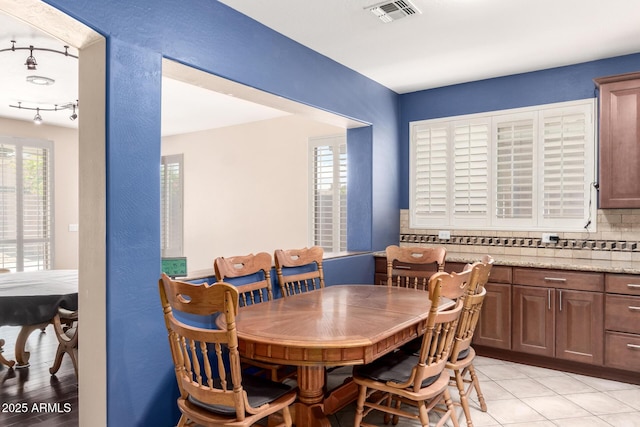 81 E Rock Wren Dr, San Tan Valley, AZ 85143 - dining space featuring healthy amount of natural light and rail lighting