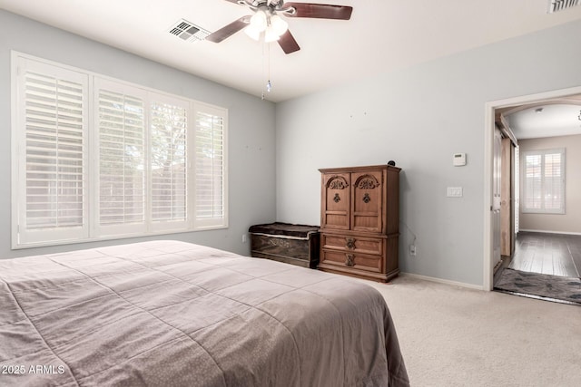 81 E Rock Wren Dr, San Tan Valley, AZ 85143 - bedroom featuring baseboards, arched walkways, carpet floors, and a ceiling fan