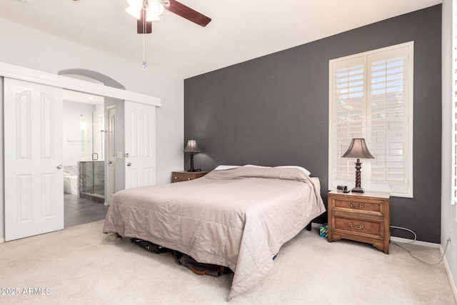 81 E Rock Wren Dr, San Tan Valley, AZ 85143 - bedroom with light colored carpet, a closet, ensuite bath, and ceiling fan
