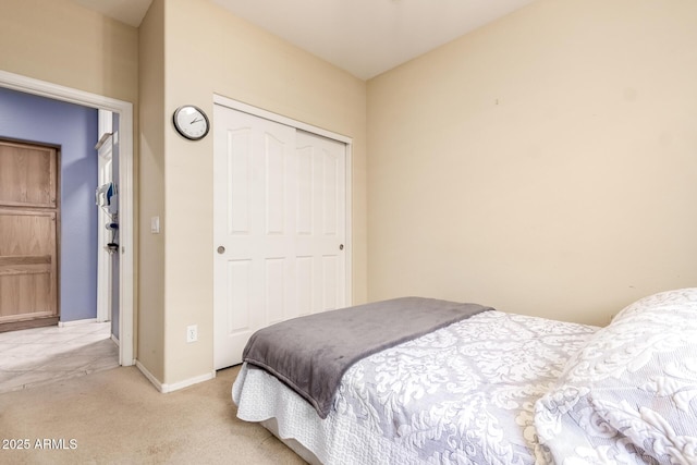 81 E Rock Wren Dr, San Tan Valley, AZ 85143 - bedroom featuring a closet, light carpet, and baseboards