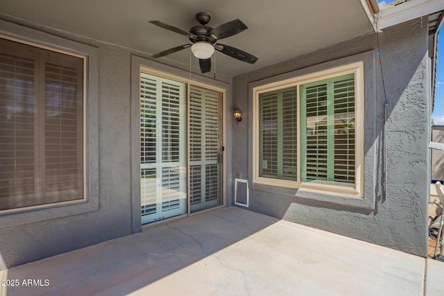 81 E Rock Wren Dr, San Tan Valley, AZ 85143 - doorway to property featuring ceiling fan, a patio, and stucco siding