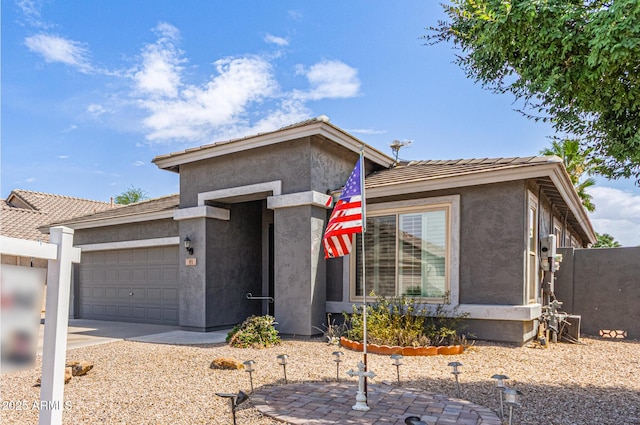81 E Rock Wren Dr, San Tan Valley, AZ 85143 - view of front facade featuring stucco siding, a garage, a tile roof, and driveway