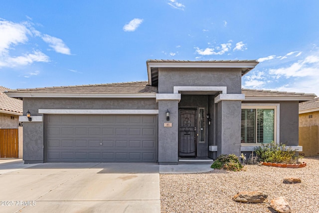 81 E Rock Wren Dr, San Tan Valley, AZ 85143 - view of front facade with concrete driveway, an attached garage, and stucco siding