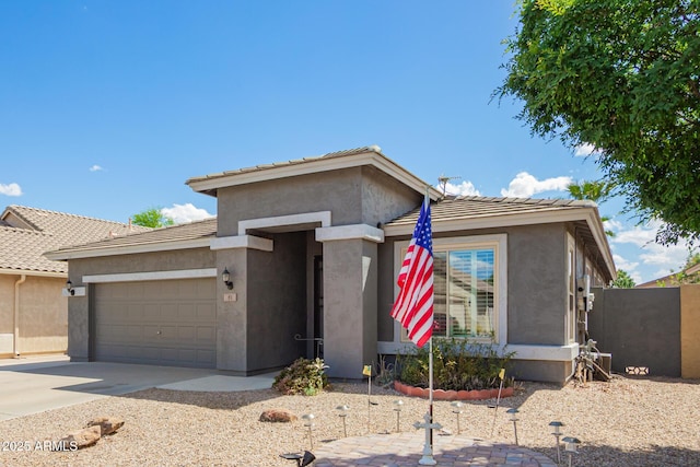81 E Rock Wren Dr, San Tan Valley, AZ 85143 - view of front of home featuring stucco siding, a garage, concrete driveway, and a tiled roof