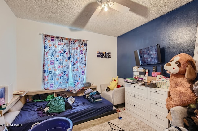 13802 N 37th Dr, Phoenix, AZ 85053 - carpeted bedroom with a textured ceiling and a ceiling fan