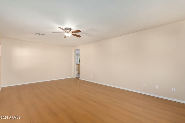 spare room featuring ceiling fan and light wood-type flooring