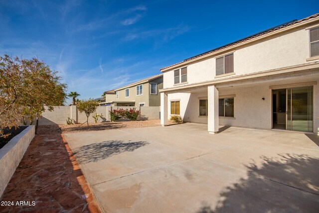 back of property with a patio area