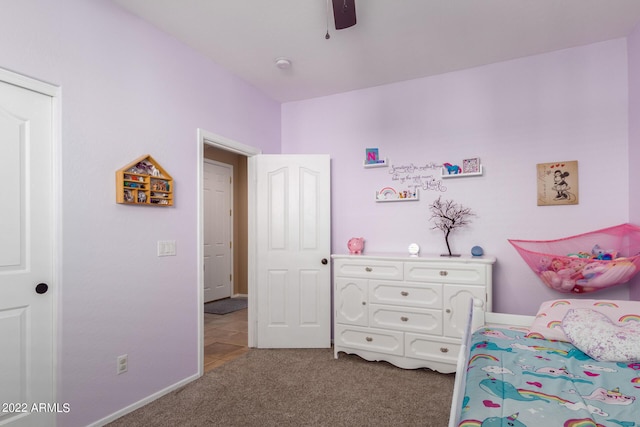 carpeted bedroom featuring ceiling fan