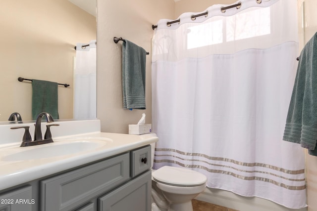 bathroom featuring vanity, toilet, and a shower with shower curtain