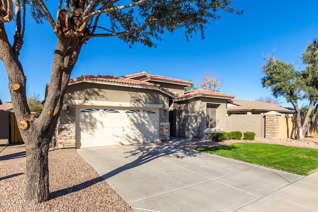 mediterranean / spanish-style house featuring a garage