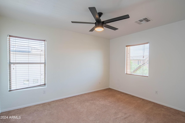 carpeted empty room with ceiling fan