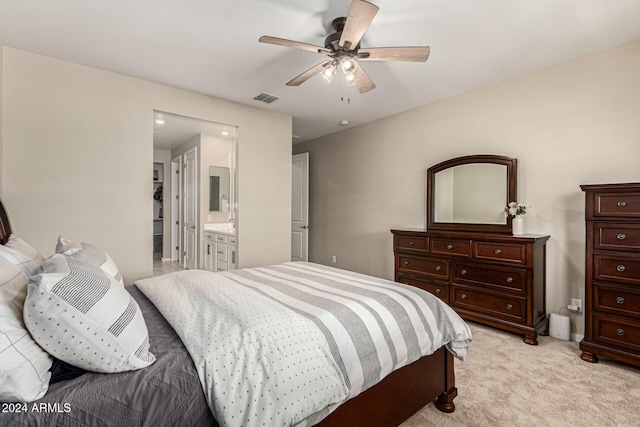 carpeted bedroom with ceiling fan and connected bathroom