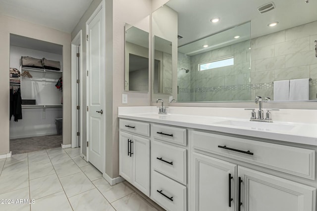 bathroom featuring vanity and a tile shower