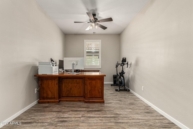 office space featuring wood-type flooring and ceiling fan