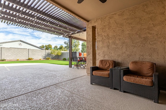 view of patio / terrace with ceiling fan and a pergola