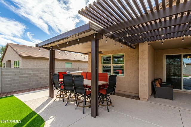 view of patio featuring ceiling fan and a pergola