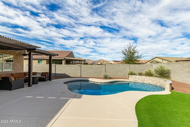 view of swimming pool with an outdoor living space and a patio area