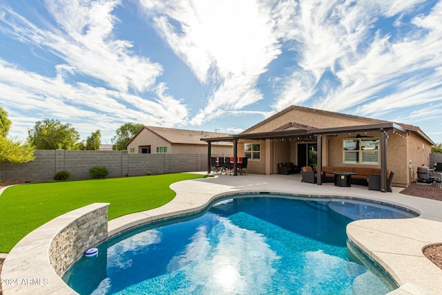 view of pool featuring a patio and a lawn