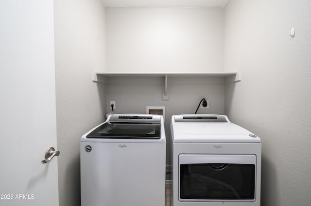 laundry room with laundry area and washer and clothes dryer