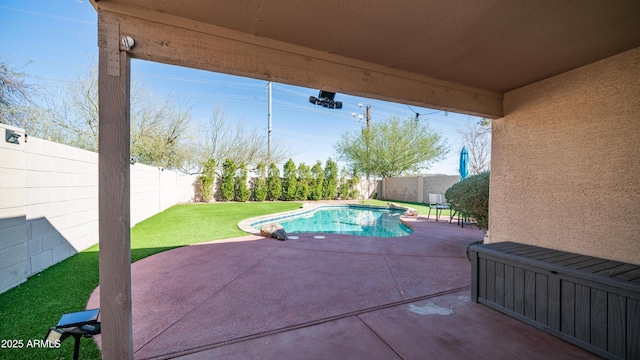 view of swimming pool featuring a fenced in pool, a yard, a fenced backyard, and a patio