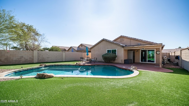 view of pool with a lawn, a patio area, a fenced backyard, and a fenced in pool