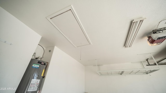 interior space featuring water heater and a garage door opener