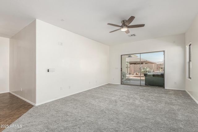 unfurnished room featuring carpet flooring and ceiling fan