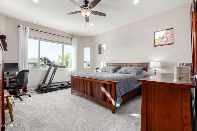 bedroom featuring ceiling fan and light carpet