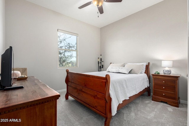 bedroom with ceiling fan and light colored carpet