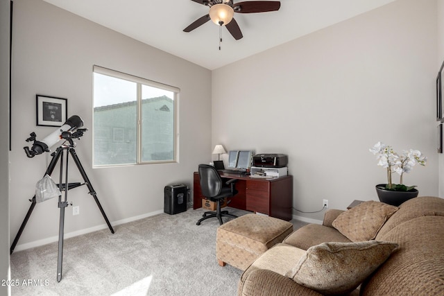 office area with ceiling fan and light carpet