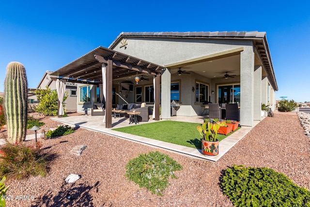 back of property featuring a pergola, ceiling fan, and a patio