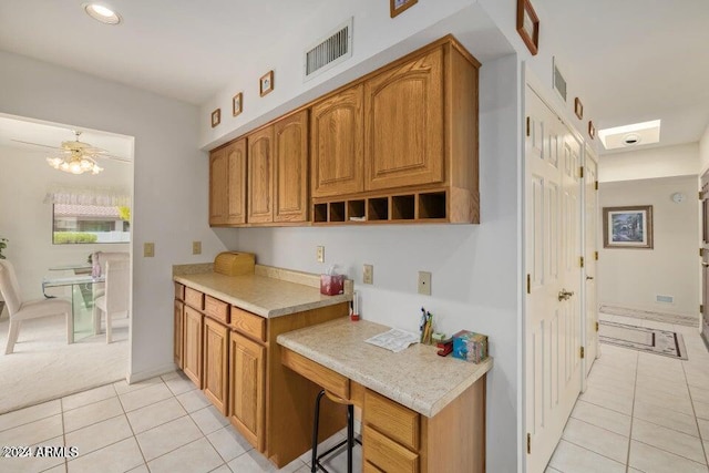 kitchen featuring ceiling fan and light tile patterned floors