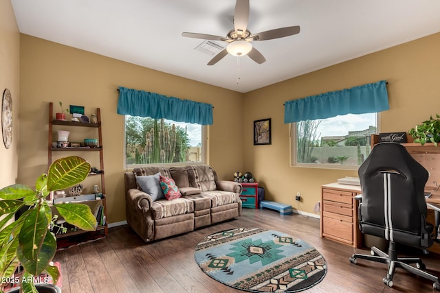 office space with a ceiling fan, plenty of natural light, and wood finished floors