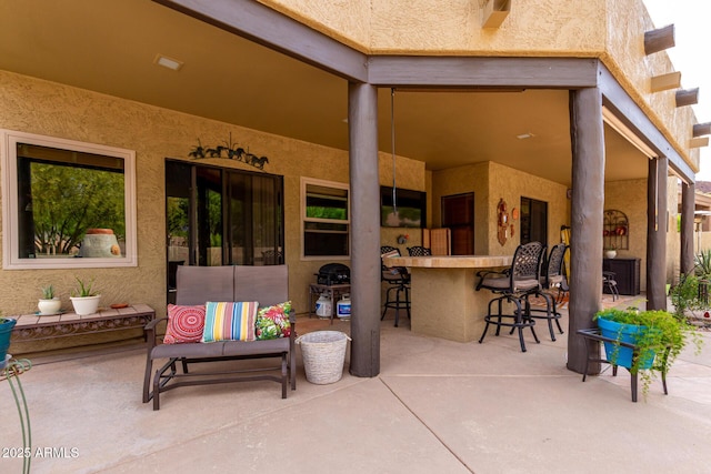 view of patio with outdoor dry bar