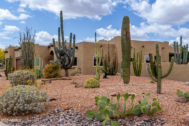 exterior space featuring stucco siding
