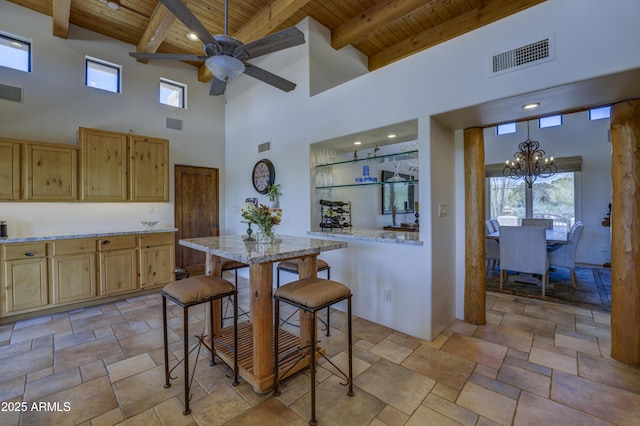 1401 E Boulder Pass, Carefree, AZ 85377 - kitchen featuring a high ceiling, visible vents, wood ceiling, and light brown cabinets