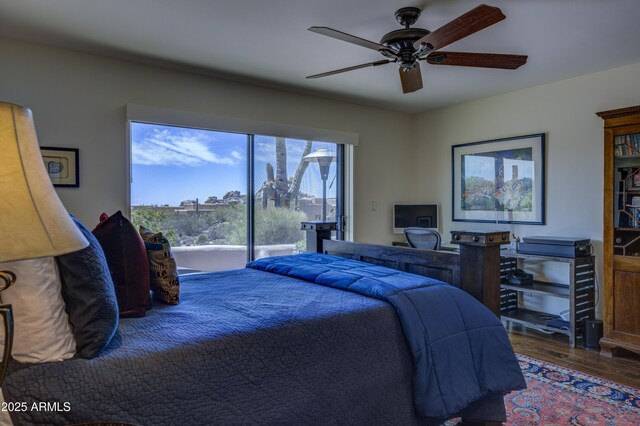 1401 E Boulder Pass, Carefree, AZ 85377 - bedroom featuring access to outside, a ceiling fan, and wood finished floors