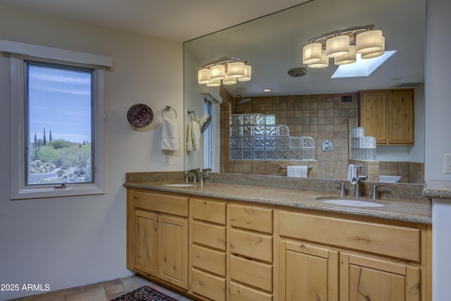 1401 E Boulder Pass, Carefree, AZ 85377 - bathroom featuring a walk in shower, double vanity, decorative backsplash, and a sink