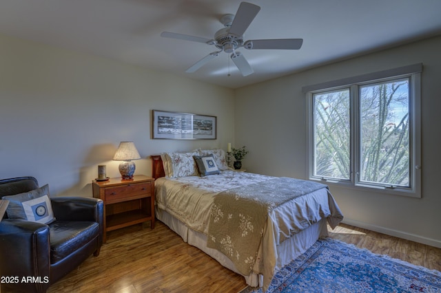 1401 E Boulder Pass, Carefree, AZ 85377 - bedroom featuring baseboards, ceiling fan, and wood finished floors