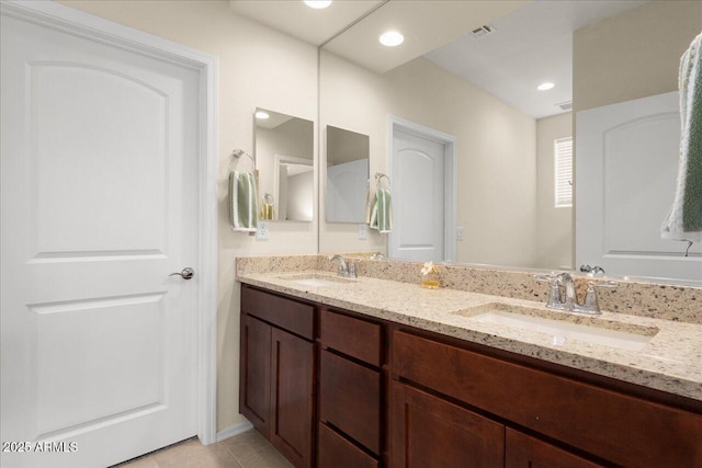 26947 W Adam Ave, Buckeye, AZ 85396 - bathroom with double vanity and tile patterned flooring