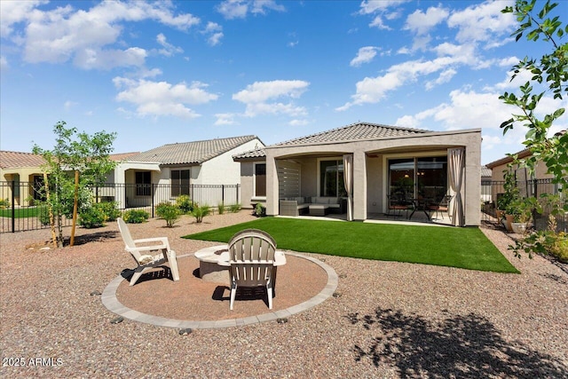 26947 W Adam Ave, Buckeye, AZ 85396 - rear view of house featuring an outdoor living space with a fire pit, a tiled roof, stucco siding, and a patio