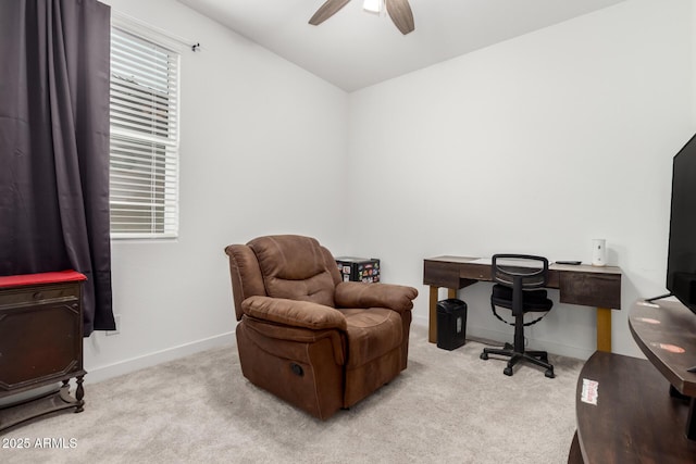 carpeted office with ceiling fan