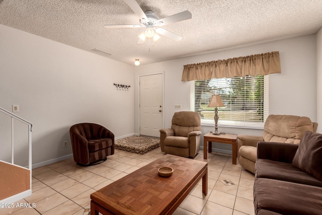 5808 E Brown Rd Unit 119, Mesa, AZ 85205 - living area featuring a textured ceiling, a ceiling fan, baseboards, and light tile patterned floors