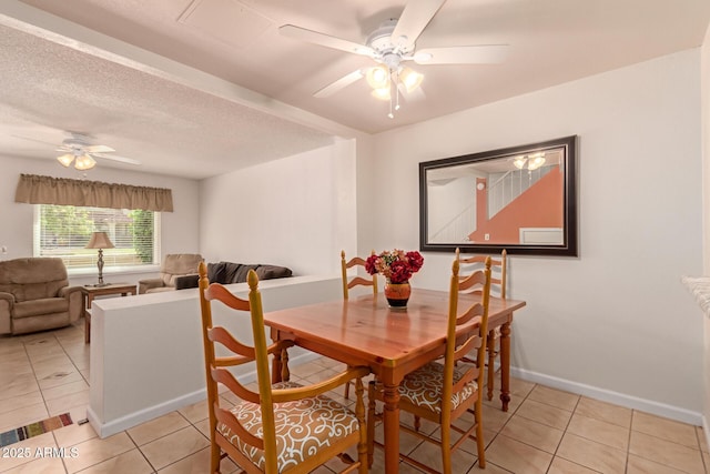5808 E Brown Rd Unit 119, Mesa, AZ 85205 - dining room featuring baseboards, ceiling fan, and light tile patterned floors