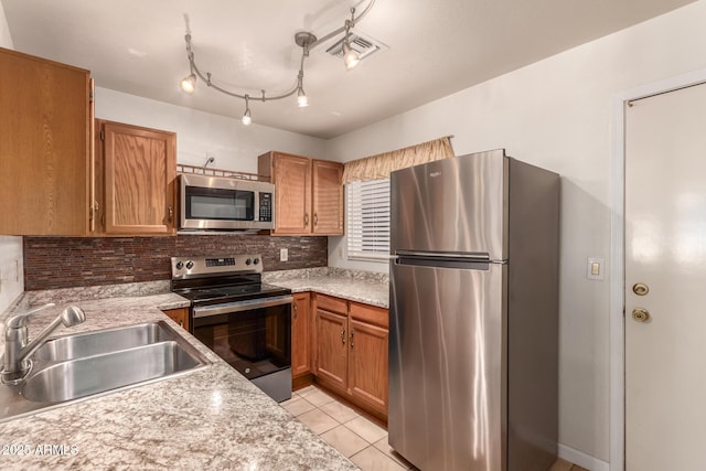 5808 E Brown Rd Unit 119, Mesa, AZ 85205 - kitchen featuring light countertops, appliances with stainless steel finishes, decorative backsplash, and a sink