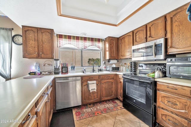 18903 N 97th Ln, Peoria, AZ 85382 - kitchen featuring appliances with stainless steel finishes, a sink, light countertops, and light tile patterned floors