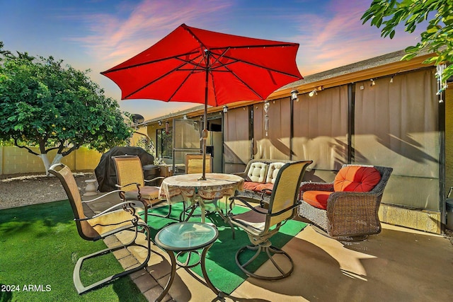 patio terrace at dusk with a yard