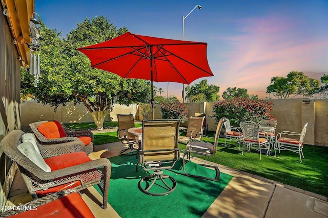 patio terrace at dusk with a yard